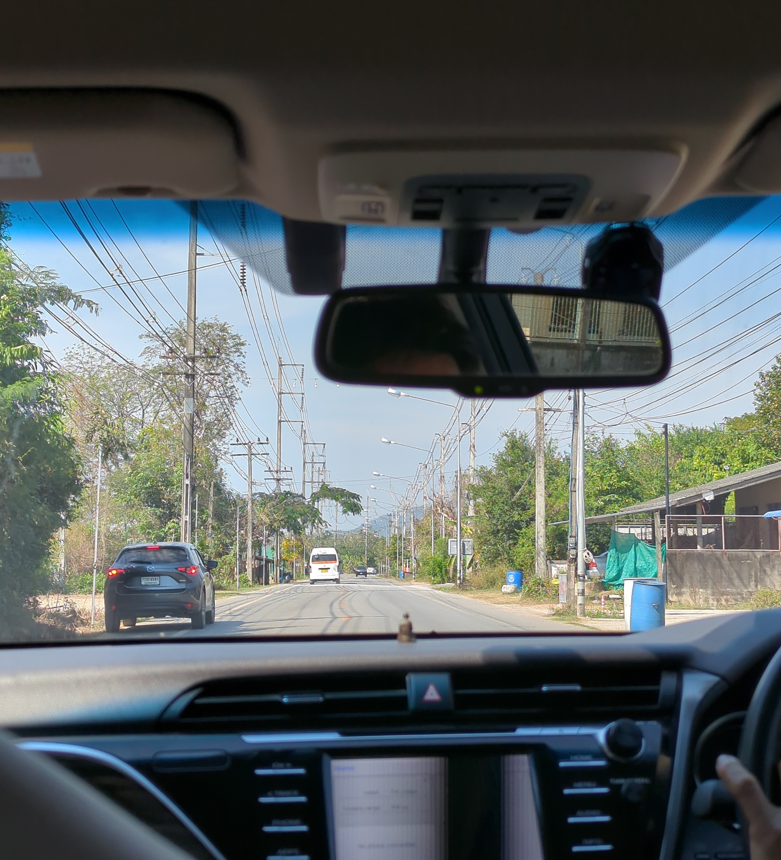 On the road to Wat Marp Jan. Bear and I stopped to eat one last layperson meal in Rayong on the way: boat noodles and mango sticky rice for breakfast. It would be our only meal that day.